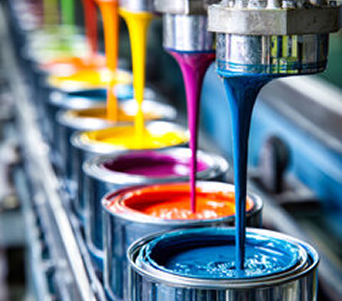 Paint being poured into cans on a production line